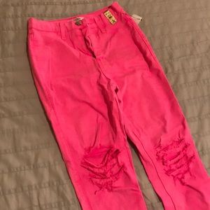 Neon pink destroyed jeans